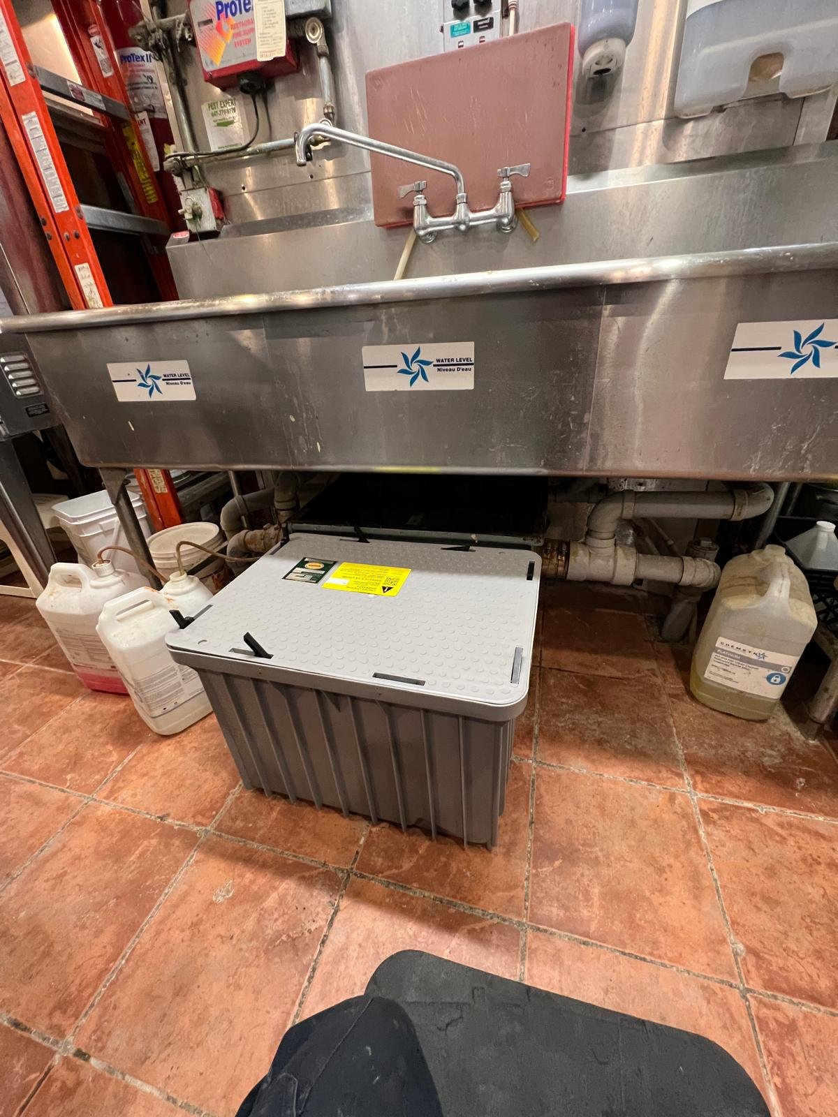 Grease interceptor installation for commercial kitchen